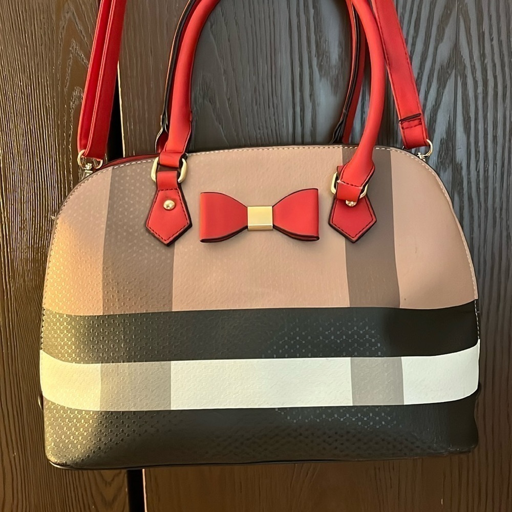 No Brand red bow purse. Black, tan, white, gray and beige design. Straps detach.